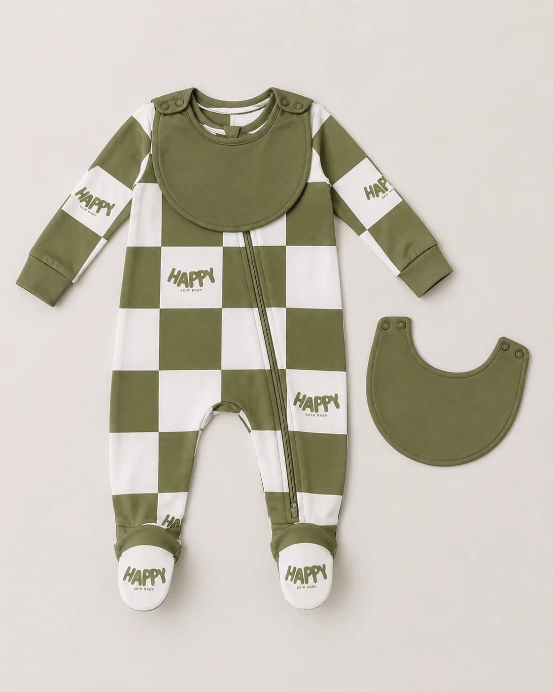 The Everything Zippy laid flat with its bib snapped on, next to a second bib unsnapped