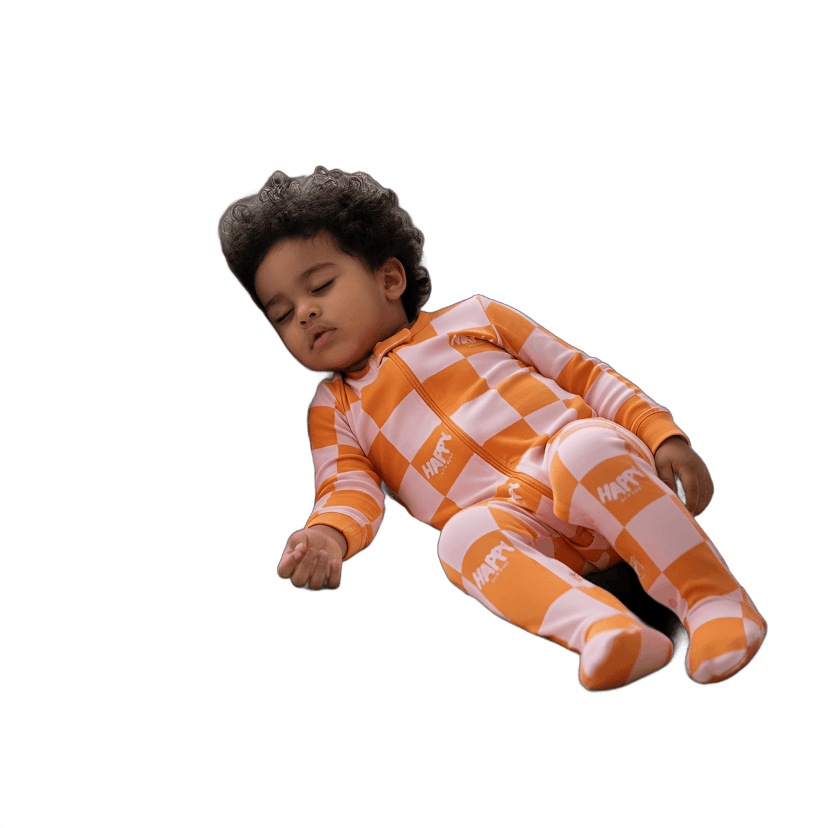 Sleeping baby in Happy Skin Baby's orange and pink checker footed pajama